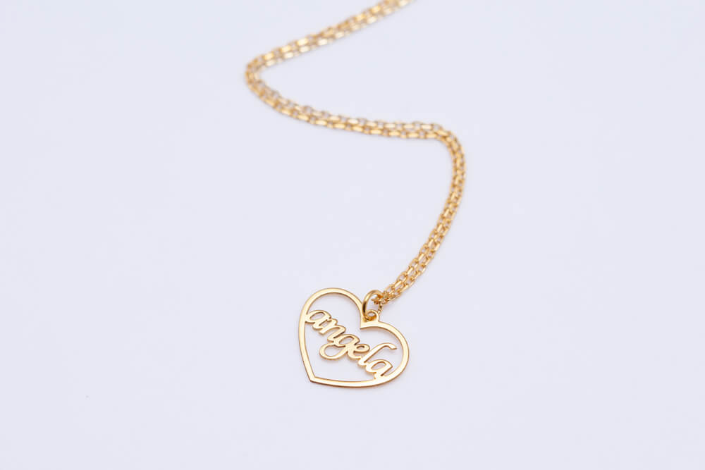 A chain with a pendant that says Angela. Get 32 best gifts for single moms here.