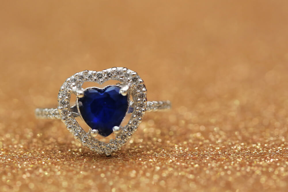 A ring with a blue heart-shaped stone. Find out more about our 32 best gifts for single moms.
