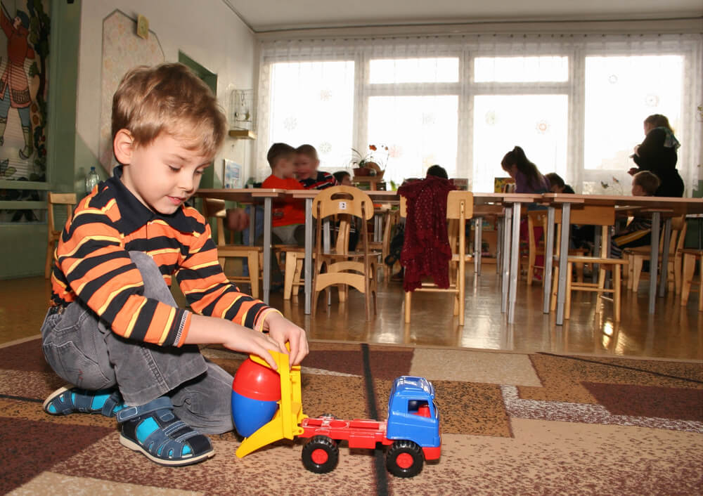 A child playing in a daycare. Child care is a recession-proof business.