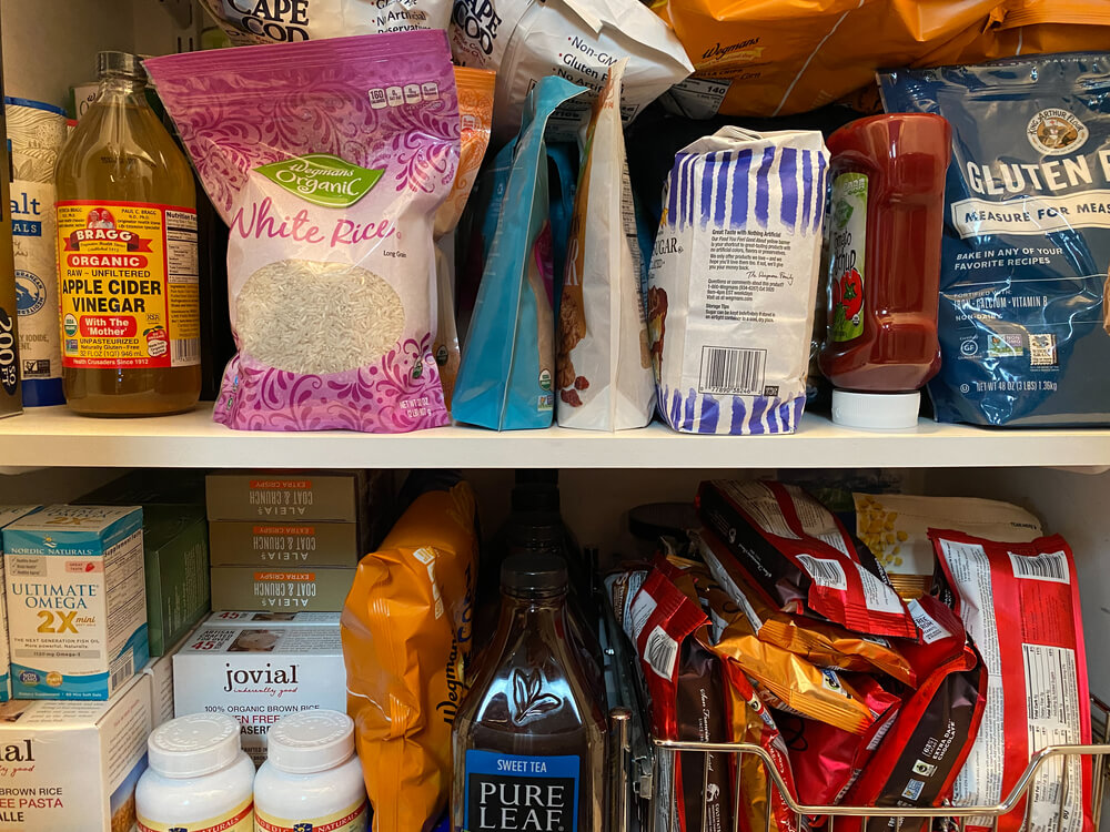 Shelves full of food supplies. Here are 9 ways to get free groceries, food, and meals in 2024.