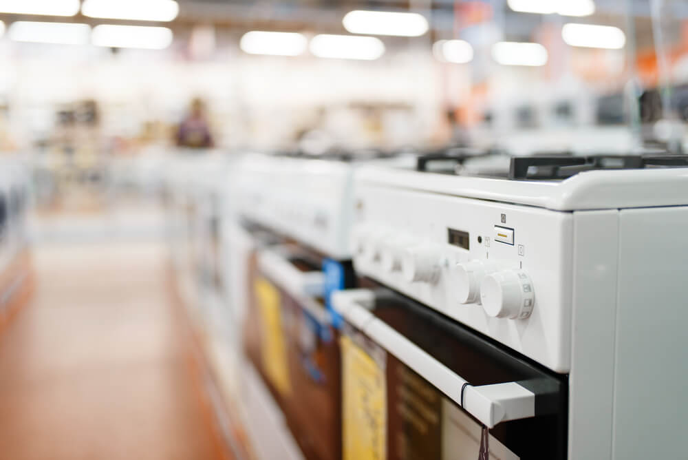 Some appliance stores will haul away old appliances.