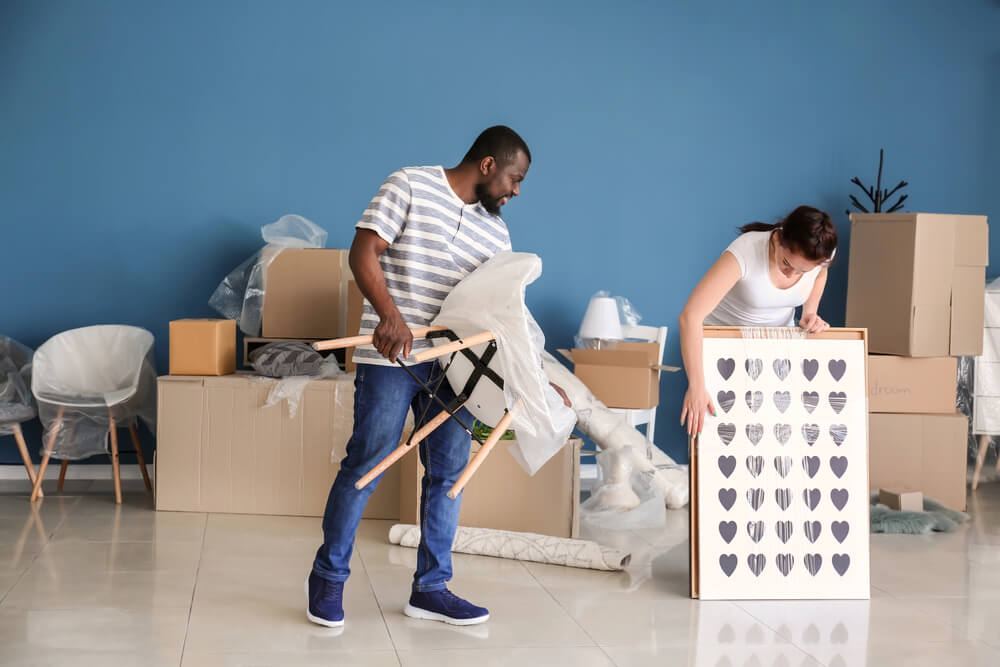 The husband and wife packs furniture before moving out. If you're moving out and you have pieces of furniture you no longer want, you can donate them to some organizations.